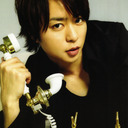 Sakurai Sho awkwardly holding things.